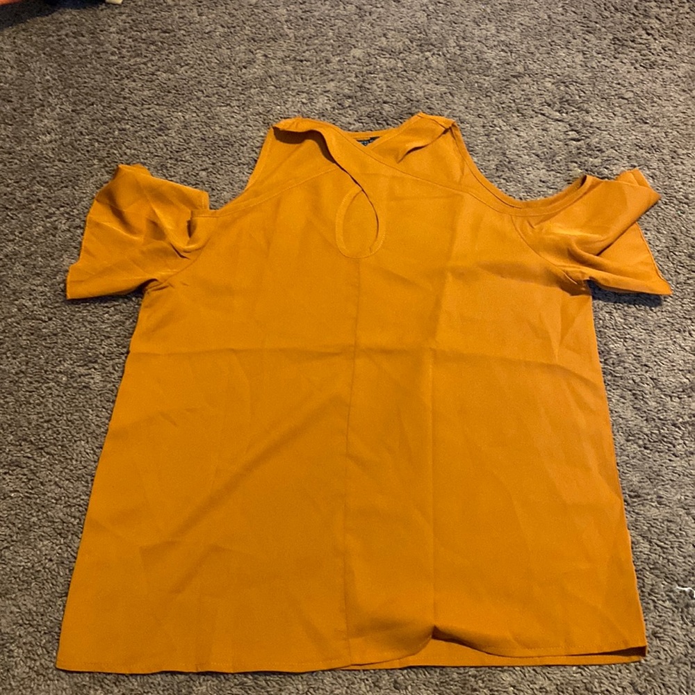 dressy top, shoulders are cut out